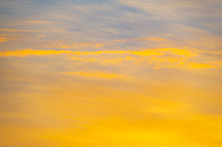 Prepare to be inspired by nature's extraordinary masterpiece, where the sky meets the earth in a breathtaking pastel-colored spectacle at sunrise! Skyline Serenade Cloudy Canvasの写真素材