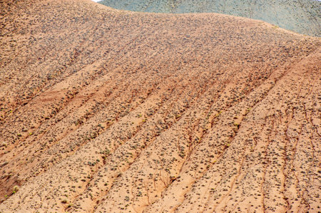 Texture and background inspired by the Red Mountains of Boguty. Red clay is used as a key element. Gives a unique and earthy look to any design or project.の写真素材