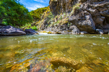 Enjoy the awesome-inspiring beauty of nature. See how the river means through the rocky canyon. Feel the peace and tranquility in the heart of the mountains.の写真素材
