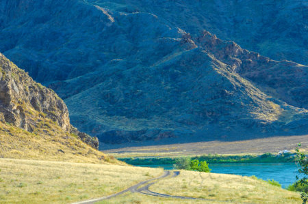 Explore the beauty of the summer steppe through this river. Feel the power and grandeur of nature. Journey from the mountains to the sea under the guidance of the mighty river.の写真素材