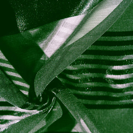 Silk fabric. light transparent silk fabric with stripes of different sizes, green. texture, background, patternの写真素材