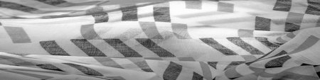 White silk fabric with black geometric rhombus shapes. dark. Background. Template.の写真素材