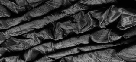Premium black silk fabric is an exceptional fabric, beautiful on its own or as an accessory to highlight your perfect choice.の写真素材