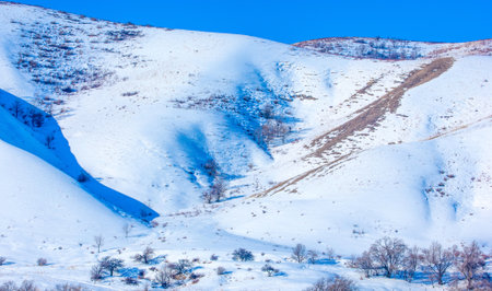 mountains winter and snow. Whether you admire the towering beauty of the mountains from afar or up close, there's no denying how enchanting they are.の写真素材