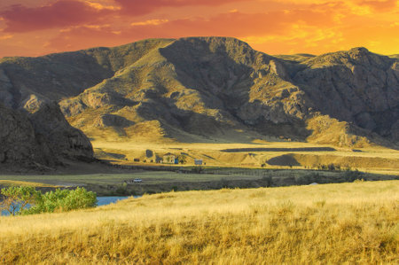 Explore the beauty of the summer steppe and its majestic river. Experience the thrill of rafting down the mighty river. Discover the unique flora and fauna along the river banks.の写真素材