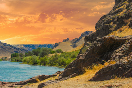 Enjoy the breathtaking beauty of the steppe landscape. Relax and unwind in a tranquil environment. Witness stunning sunsets over the river and cliffs. Feel in harmony with natureの写真素材