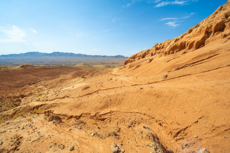 Experience the breathtaking beauty of the Red Mountains. Witness a stunning sunset over the horizon. Immerse yourself in the peace and serenity of this magical place.の写真素材