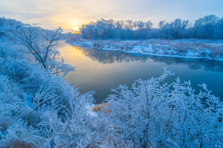 Experience the beauty of nature as the sun sets over the icy river. Witness the breathtaking...
