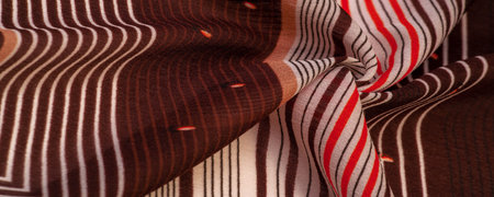silk fabric, brown background with striped pattern of white and red lines, spanish theme, texture,...