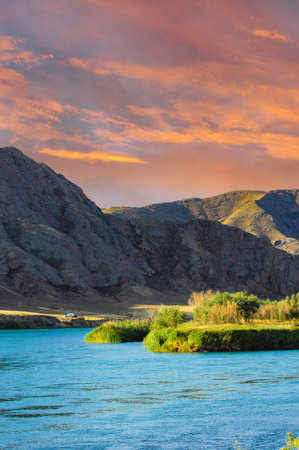 Explore the breathtaking river scenery. Discover unique wildlife along the river banks. Enjoy camping under the stars by the river.の写真素材