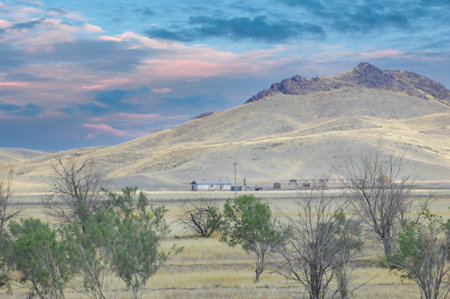 prairie, plain, desert. Embrace the wild beauty of a fiery sunset in the Nature Unleashed wilderness. Watching the magnificent canvas of nature unfold across the vast expanses of the desertの写真素材