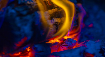 Create a warm and cozy atmosphere with burning wood. The flame is bright and energetic. Adds warmth to any space. Enjoy the soothing crackle of wood.の写真素材