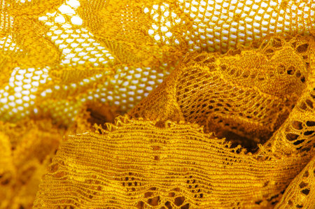 Fashionable and decorative yellow lace Can be used as an elastic band or home decor Adds texture to designs, backgrounds and patterns Jacquard design adds unique detail to any garmentの写真素材