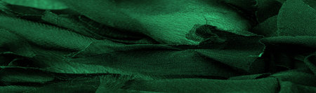 Texture. Background. Green silk fabric, view from above. Smooth elegant green silk or satin luxury cloth texture can use as abstract background with copy space.の写真素材