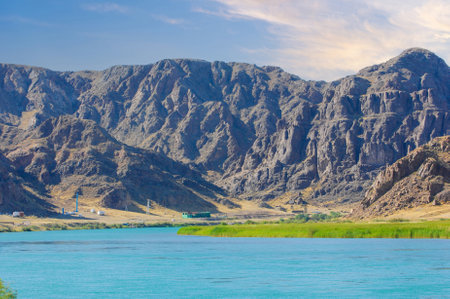 Feel the peaceful flow of the river surrounded by natural rock formations. Enjoy the beauty of nature while walking along the river bank. Find serenity and peaceの写真素材