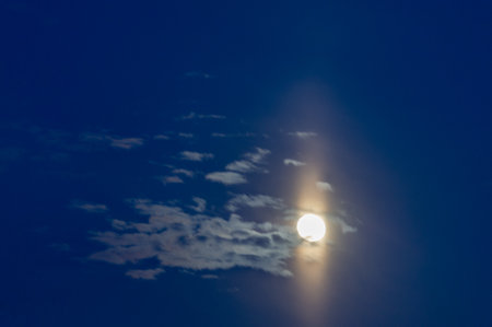 Clouds float into my life, not to bring rain or cause a storm, but to add color to my sunset sky. The sun always shines above the cloudsの写真素材
