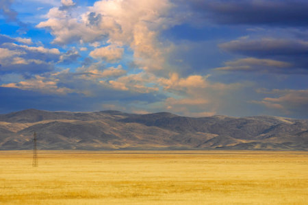 The sky sparkles with fiery hues as the sun dips below the horizon, leaving the land to face another night. A vivid reminder of the ebbs and flows of life.の写真素材