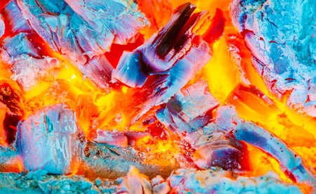 Create a cozy and warm atmosphere with a beautiful fire. Burning logs add atmosphere to any space. Enjoy crackling sounds and the mesmerizing flames of a burning campfire.の写真素材