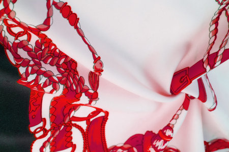 Silk fabric in black, white and red colors. Heraldic shield with angel wings and ribbons for medieval design - Print on canvas. Texture background pattern.の写真素材