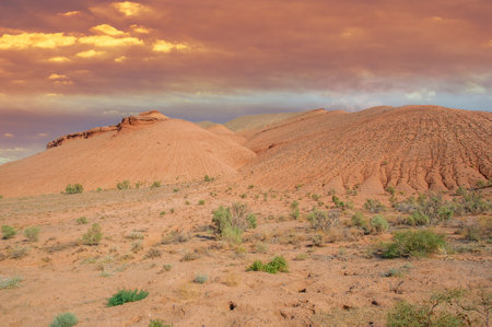 Enjoy the stunning beauty of a fiery sunset over the Red Boguty Mountains. Marvel at nature's grand finale as the landscape is bathed in a warm, golden glow. Save unforgettable memoriesの写真素材