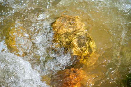 Immerse yourself in the serenity of a mountain stream. Witness the mesmerizing beauty of natural landscapes. Find inspiration in the soothing flow of water among picturesque landscapes.の写真素材