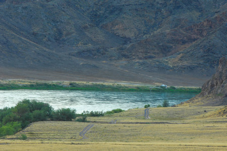 Enjoy the beauty of the steppe landscape with rocky cliffs. Enjoy a calm river flowing through...