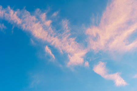 sky, Clouds float into my life, not to bring rain or cause a storm, but to add color to my sunset sky. The sun always shines above the cloudsの写真素材