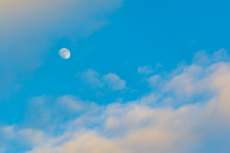Clouds float into my life, not to bring rain or cause a storm, but to add color to my sunset sky. The sun always shines above the cloudsの写真素材