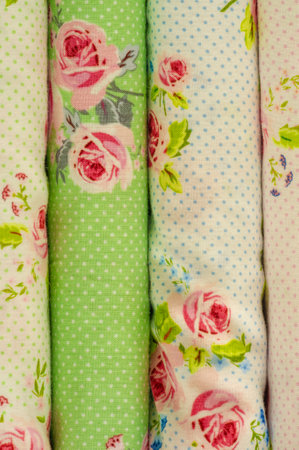 Mix fabrics. Shop counter. Many fabrics of different types. View from above. Printed, cotton, mixed jersey. For sewing clothes and bed linen.の写真素材