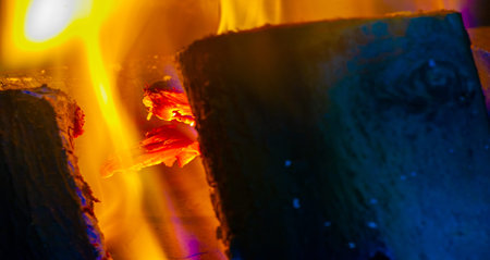 Create a cozy and warm atmosphere in your home with a fireplace Burning wood in the fireplace provides natural warmth and ambiance Enjoy crackling and mesmerizing wood flamesの写真素材