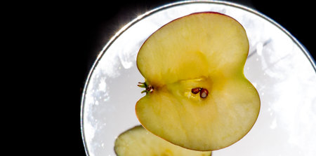 Apple on a white background. They contain pectin, quercetin, procyanidins, and vitamin C, which are beneficial.の写真素材
