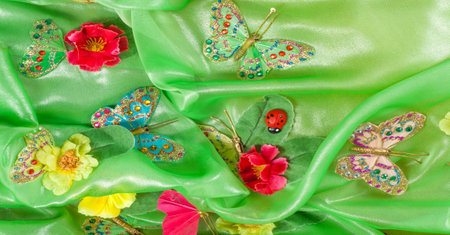 seamless. green-yellow-red fabric inlaid with flora and fauna.の写真素材