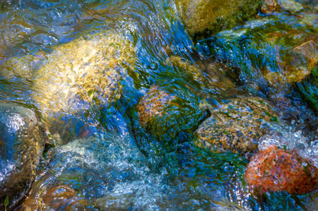 Feel the tranquility of the beauty of nature. Listen to the soothing sounds of a mountain stream. Witness the miracle of cascading water among smooth stones.の写真素材
