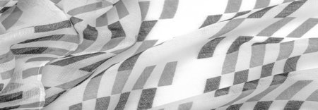 White silk fabric with black geometric rhombus shapes. dark. Background. Template.の写真素材