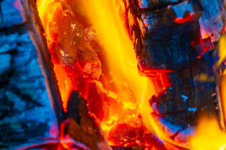 Create a cozy and inviting atmosphere with a beautiful fire. Burning logs warm and create an atmosphere in any room. Enjoy the crackling sound and mesmerizing flames of the burning fire.の写真素材