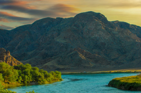 Enjoy the stunning beauty of Central Asia at sunset. Explore the unique rock formations and river landscapes of the steppe region. Connect with nature and escape the hustle and bustle of city life.の写真素材