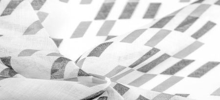 White silk fabric with black geometric rhombus shapes. dark. Background. Template.の写真素材