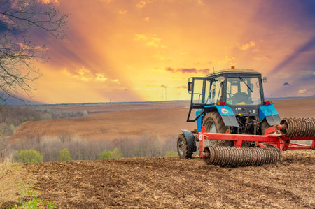 small blue tractor plow land Feel the precision and craftsmanship of our little blue tractor. Watch him plow the field with utmost care. We are preparing for a bountiful harvest. Unleash cutting-edge advances in agricultureの写真素材
