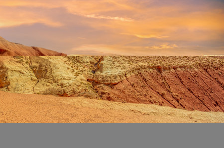 Enjoy the serene beauty of the Boguty Red Mountains. Watch as the sun sets and the colors paint the sky in a mesmerizing spectacle. Immerse yourself in the landscapeの写真素材