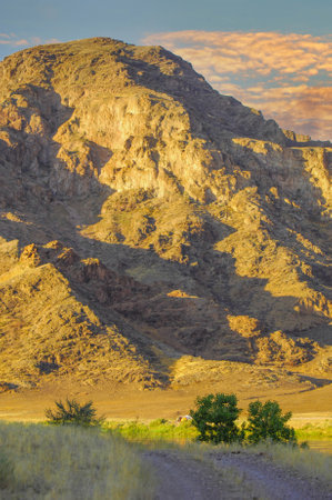 the beauty of nature in one place. See the unique contrast of elements that work harmoniously together. Watch the mesmerizing sunset over the stunning landscape. Immerse yourself in golden shadesの写真素材