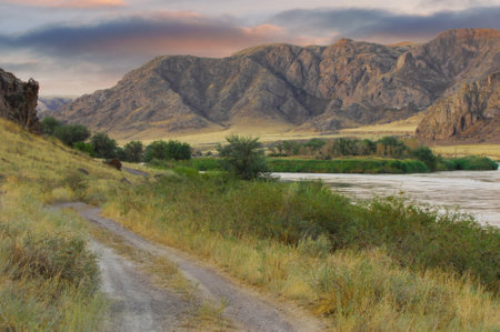 Enjoy the dramatic hues of a sunset on the steppe. Stroll along the meandering rivers and enjoy the natural beauty. Explore striking cliffs and rugged landscapes. Discover wildlife at its best.の写真素材