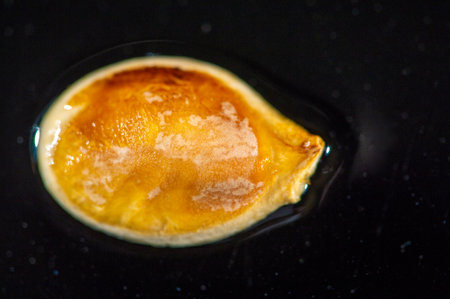 Stunning contrast of colors with pumpkin seeds and black background. Ideal for seasonal or fall themed designs. Great for food, health or nutrition related projects.の写真素材