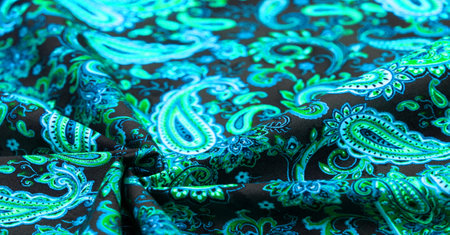 Paisley green pattern on black background In Chinese it is known as âham patternâ In Russia this pattern is known as âcucumbersâ. Boteh is a Persian word meaning bush, bunch of leaves or flower budの写真素材