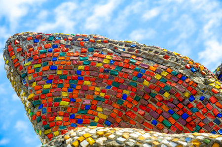Visit the vibrant display of mosaic tiles in the city. The wall showcases an intricate and colorful design. Street art lovers will be attracted by the unique exhibition.の写真素材