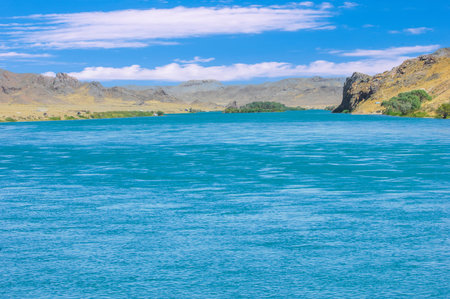 silence and tranquility in the embrace of nature. Watch the stunning colors of the sky as the sun sets over the river. Listen to the soothing sounds of flowing water and rustling leaves.の写真素材