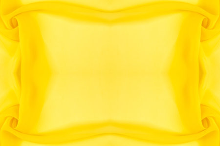 background seamless texture - yellow silk. Premium silk organza in pale yellow is an exceptional fabric, beautiful both on its own and as an accessory in terms of highlighting.の写真素材