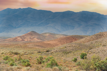 Enjoy a stunning sunset over the mountains. Experience a symphony of colors in your own masterpiece of nature. Capture vibrant effects in this breathtaking space.の写真素材