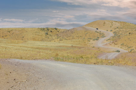 Travel through a unique and challenging landscape. Enjoy the beauty of the arid mountains. Navigate through rough terrain to reach your destination.の写真素材