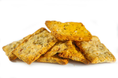 A tower of rustic crackers reveals a medley of seeds and grains in each layer, topped with hints of...