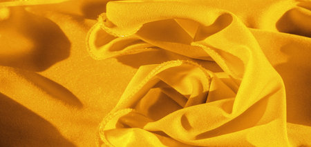 Texture, background, silk fabric, yellow woman's handkerchief; Design-friendly wallpaper design for your projects.の写真素材